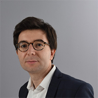 E. Monnet